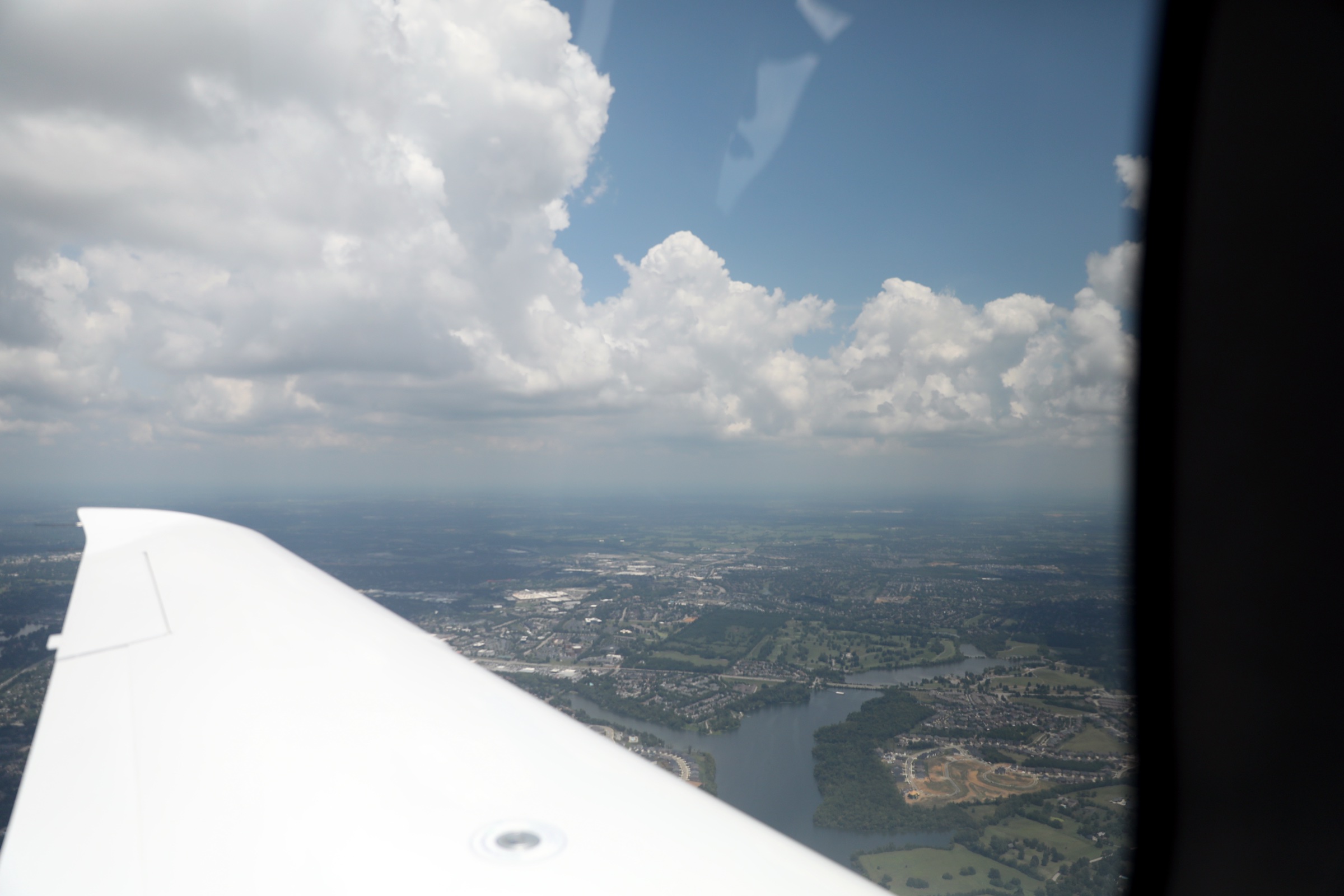 Cirrus wing over autumn countryside