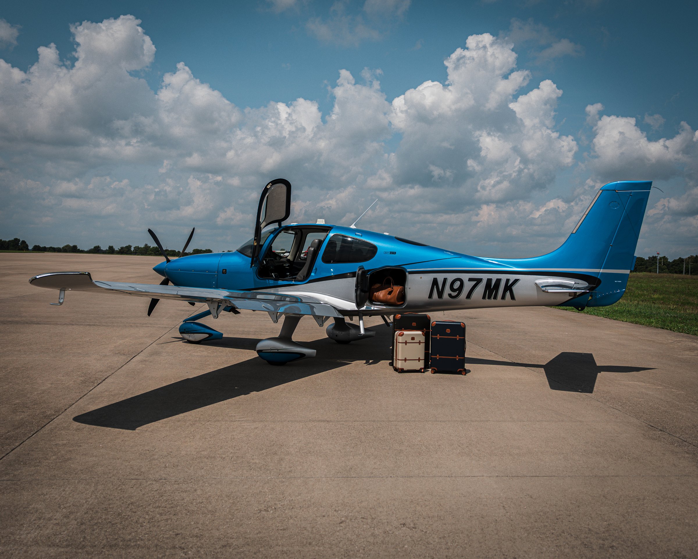Matched leather luggage loaded into a Cirrus SR