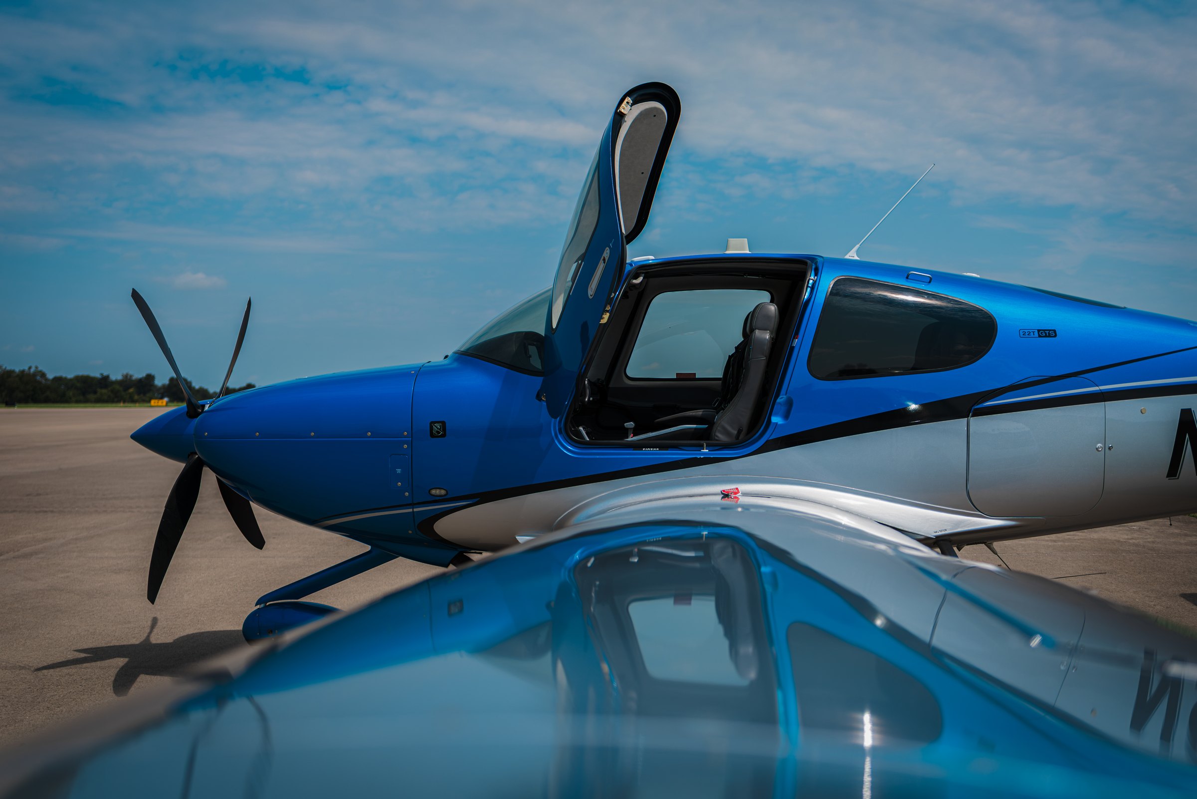 A new Cirrus SR on the ramp, canopy open