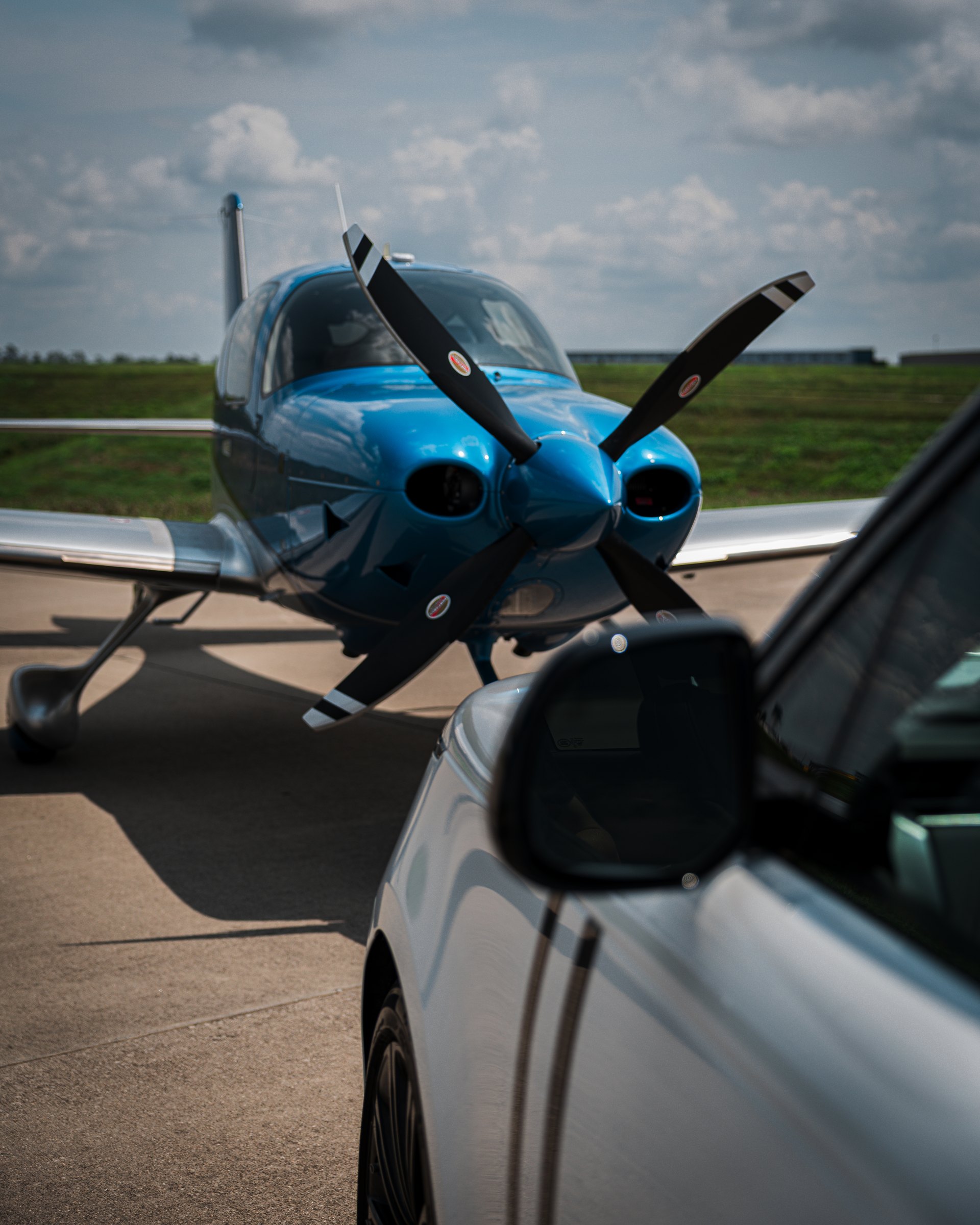 A Cirrus SR nose-on with the propeller and cowl in view