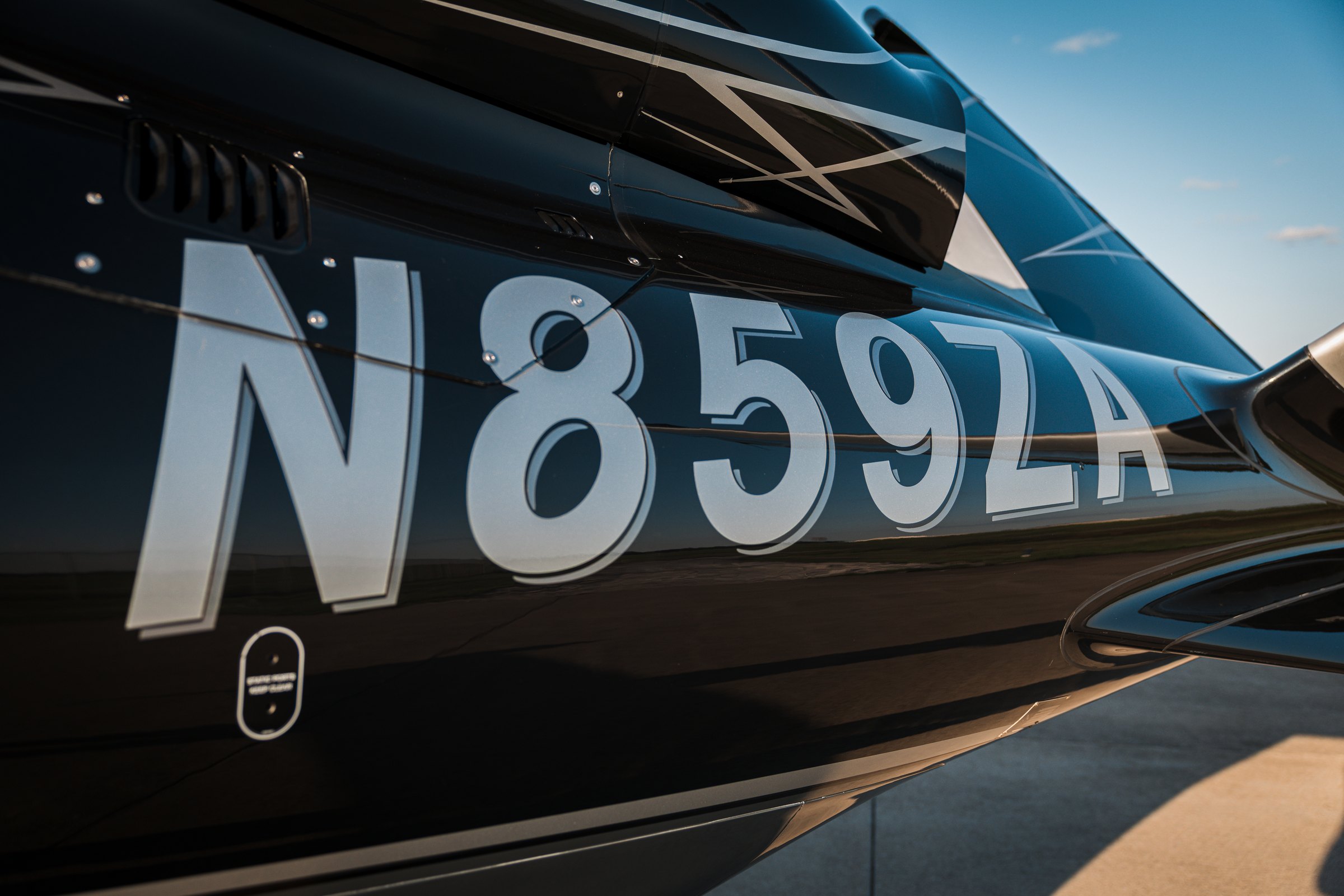 An extreme closeup of the N859ZA tail lettering on the Vision Jet