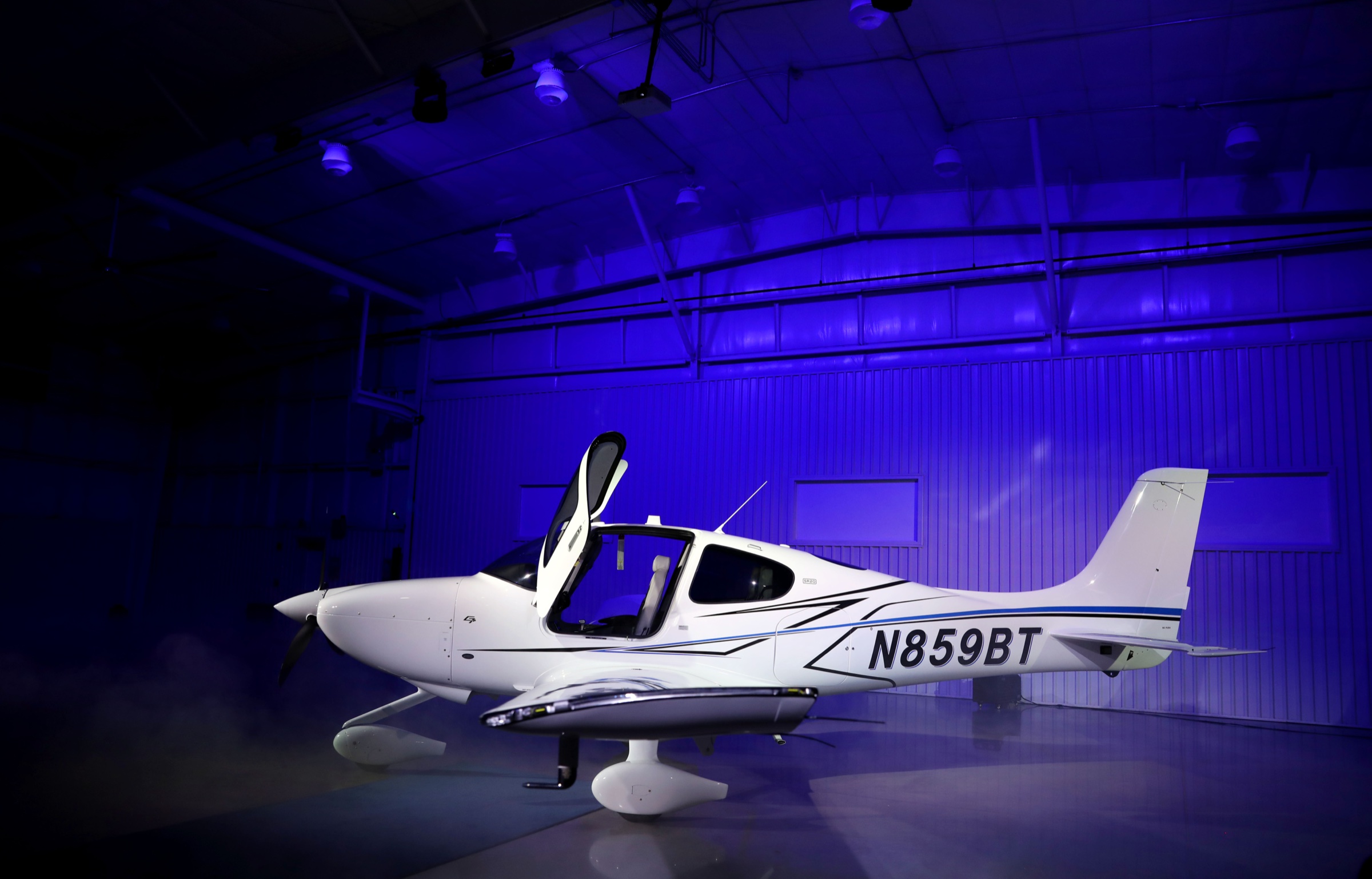 Cirrus SR20 in the hangar with dramatic lighting
