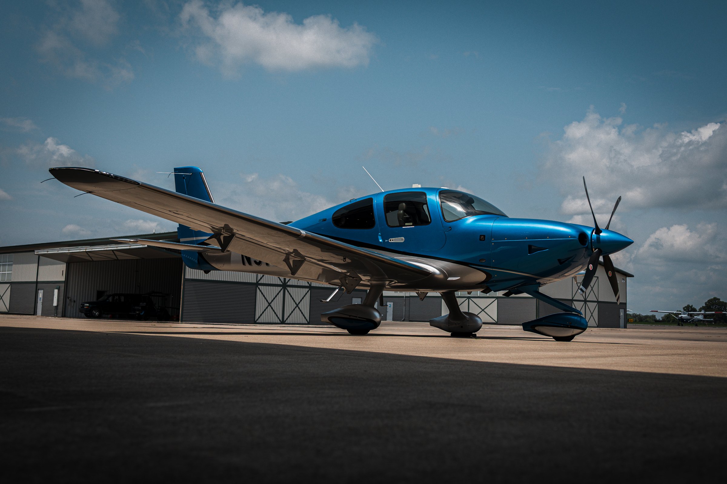 A Cirrus SR22T on the ramp at the hangar