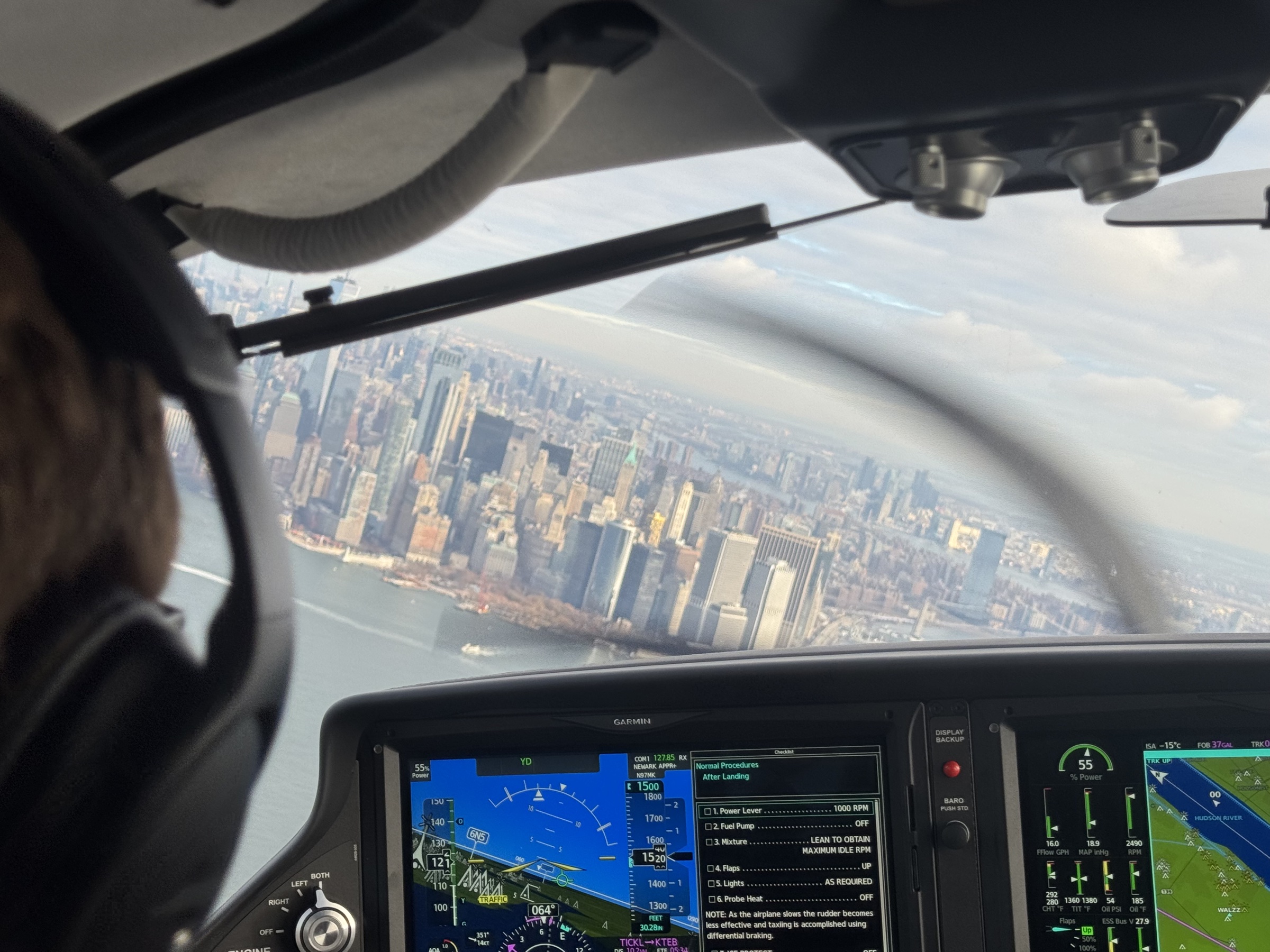 City skyline through Cirrus cockpit