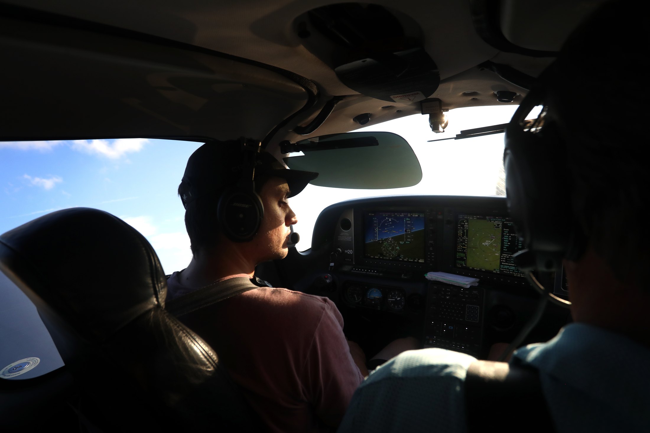 An instructor and student flying a Cirrus together over Kentucky